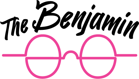 A pair of pink glasses with the words "The Benjamin" written above them.
